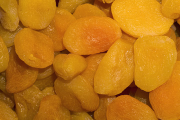 background - golden delicate confectionery dried apricots closeup