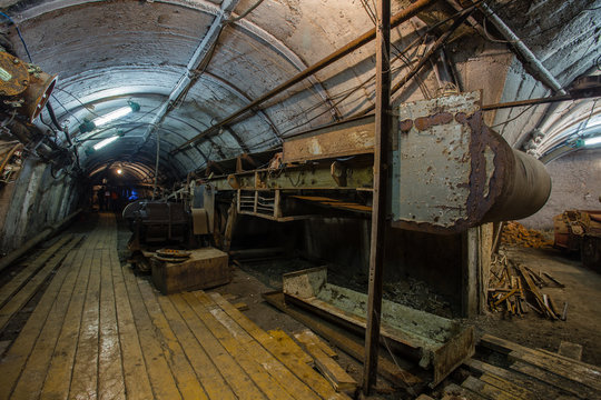 Underground coal ore mine shaft tunnel gallery with transporter conveyor