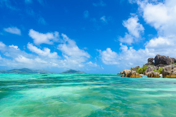 Fototapeta na wymiar Source d'Argent Beach at island La Digue, Seychelles - Beautifully shaped granite boulders and rock formation - Paradise beach and tropical destination for vacation