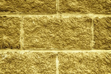 Abstract Autumn maple background of tile brick wall. Texture surface of stone wall