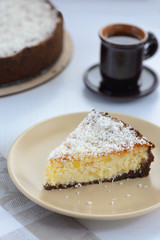 coconut cheesecake with a cup of tea