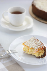 coconut cheesecake with a cup of tea