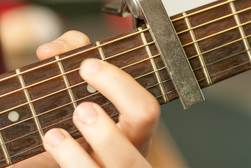 man hand playing acoustic guitar strings recreation concept