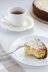 coconut cheesecake with a cup of tea