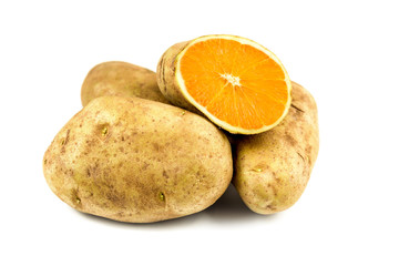 Eat your veggies! a sliced potato reveals the flesh of a fresh Orange