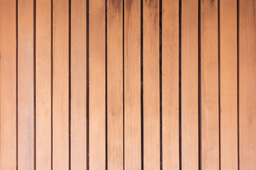 Brown wood panel background.