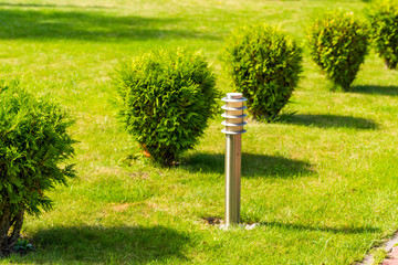 street metal chrome lamp on the lawn, horizontal frame