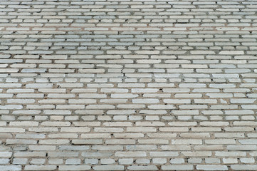 Grey texture of brick wall made of old silicate bricks.