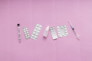 Pharmaceutical medicine pills, tablets and on pink background for health, top view, flat lay
