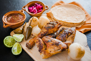 Grilled Chicken, roast, tortillas and onions mexican food in mexico city