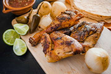 Chicken Grilled, tortillas salsa and onions mexican food in mexico city