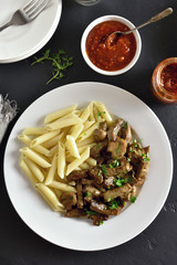 Beef stroganoff with mushrooms and pasta