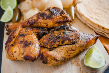 mexican Grilled Chicken , tortillas salsa and onions, food in mexico city