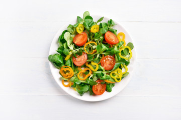 Vegetable salad from tomato, bell pepper, corn salad