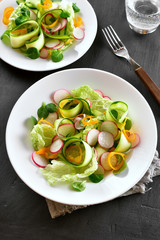 Vegetable salad from zucchini, radish, greens.