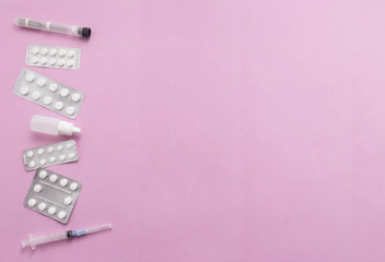 Pharmaceutical medicine pills, tablets and on pink background for health, top view, flat lay copy space