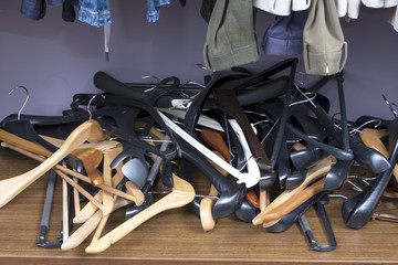 Hangers for clothes piled in a heap.