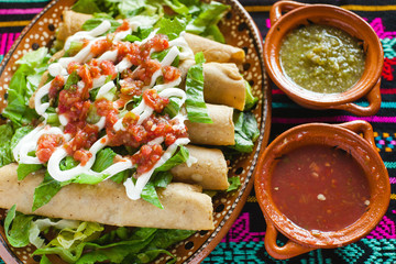 flautas de pollo, chicken tacos and Sauce Mexican food in mexico city