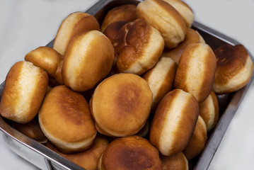 baking donuts in oil on a home stove
