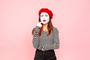 Pondering woman with quizzical grimace thinking