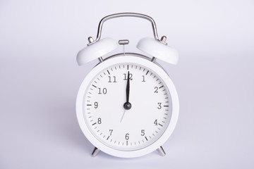 clock with the twelfth hour on a white background