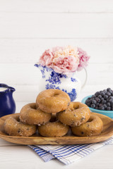 Blueberry Cake Donuts on a White Wooden Table