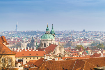 Fototapeta na wymiar Prague roofs view with The Church of Saint Francis of Assisi in the center, Prague, Bohemia, Czech Republic