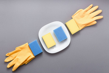 Concept of washing dishes on grey background top view flat lay