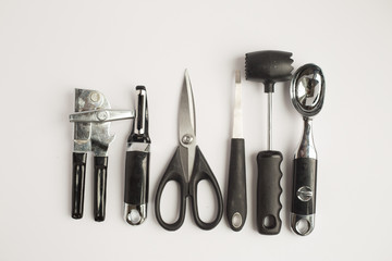 Black and steel kitchen gadgets shot overhead
