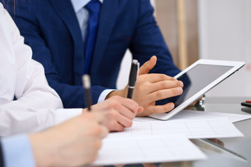 Bookkeepers team or financial inspectors  making report, calculating and checking balance. Tax service financial document. Audit or meeting concept