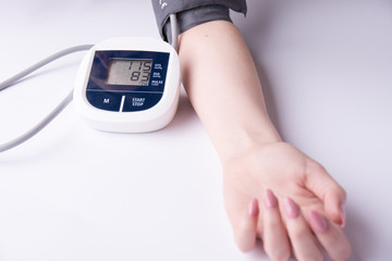 measuring blood pressure on a white background