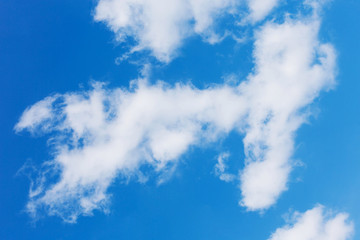 cloud in the shape of an angel against the blue sky