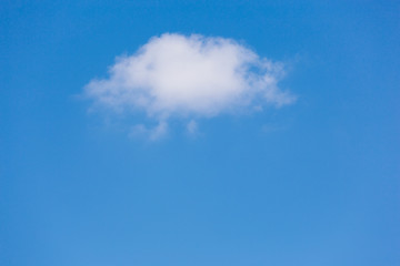 a cloud of fanciful shapes against a blue sky