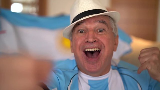 Argentina Father and Son Fans Watching and Celebrating a Soccer Game