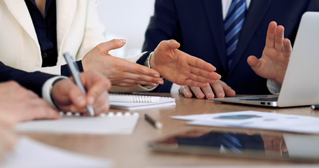 Group of business people or lawyers  at meeting, hands close-up
