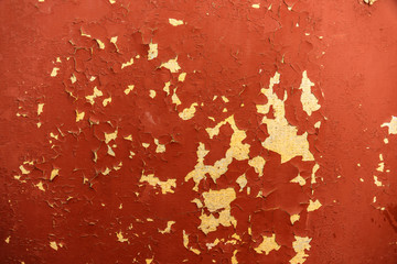 retro texture of an orange wall with a yellow crack
