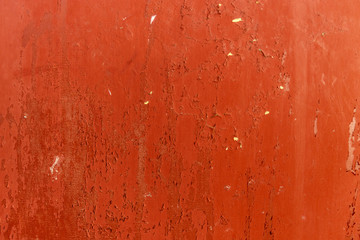 retro texture of an orange wall with a yellow crack