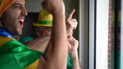 Father and Son Celebrating Brazilian Victory - Powered by Adobe