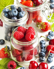 Summer berries in glass jar