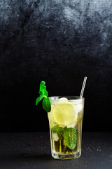  iced green tea with lemon and fresh mint .Copy space