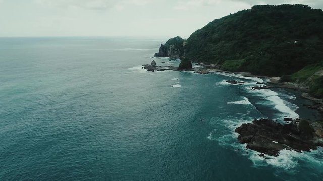 Tracking in aerial footage of WATULUMBUNG beach, South Yogyakarta, Indonesia - March, 2018