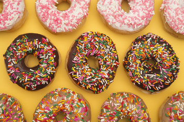 Sprinkle Donuts on a Yellow Background