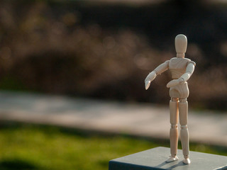 Wooden mannequin making movements