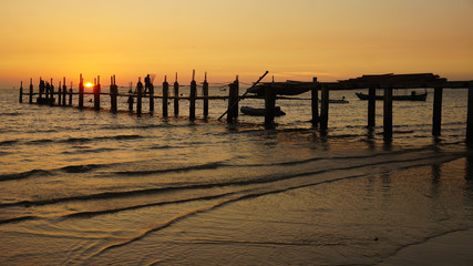 wooden jetty in the sunset
