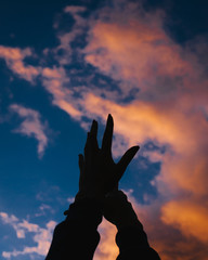 hands and sky
