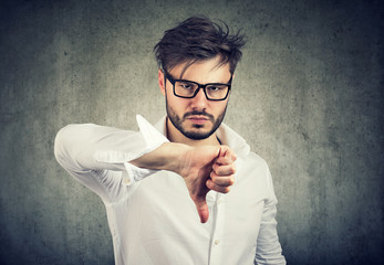 Upset man showing thumb up