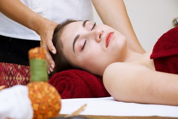 Obraz na płótnie Canvas Woman is being massaged in spa