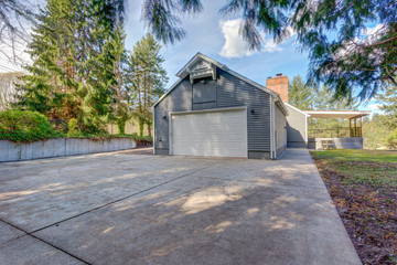 Large one story home exterior with gray siding