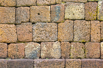 The ancient stone walls are arranged in orderly layers.