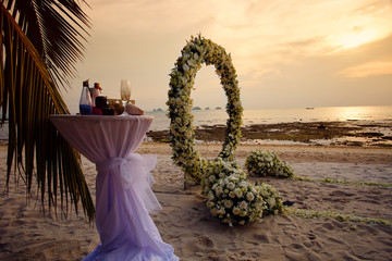 Evening beach with wedding ceremony flowers ring in the koh Samui Thailand